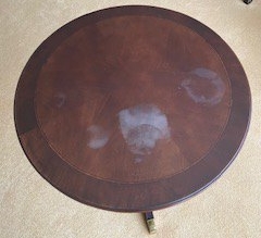 Table with old finish and water stains